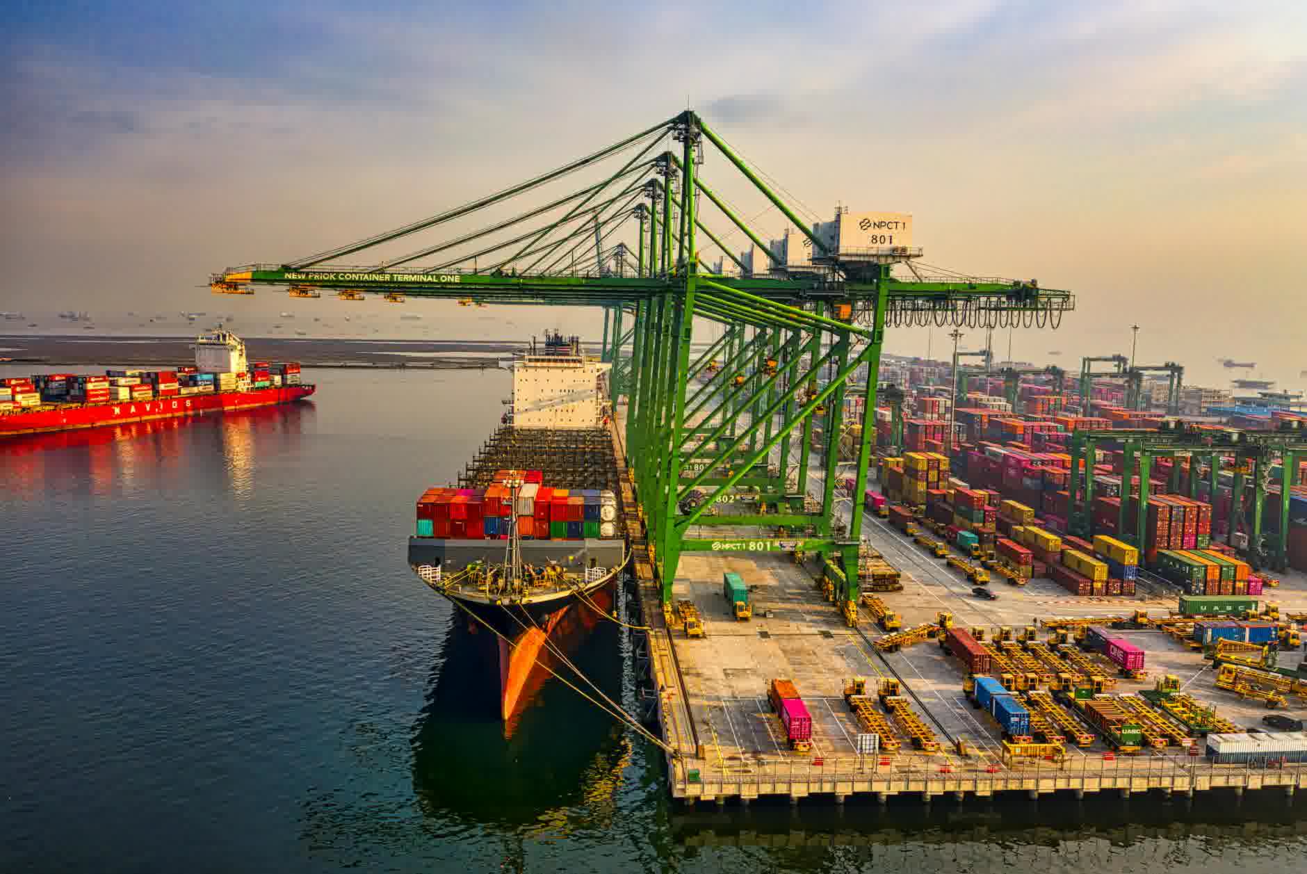 drone shot of a docked cargo ship at a port